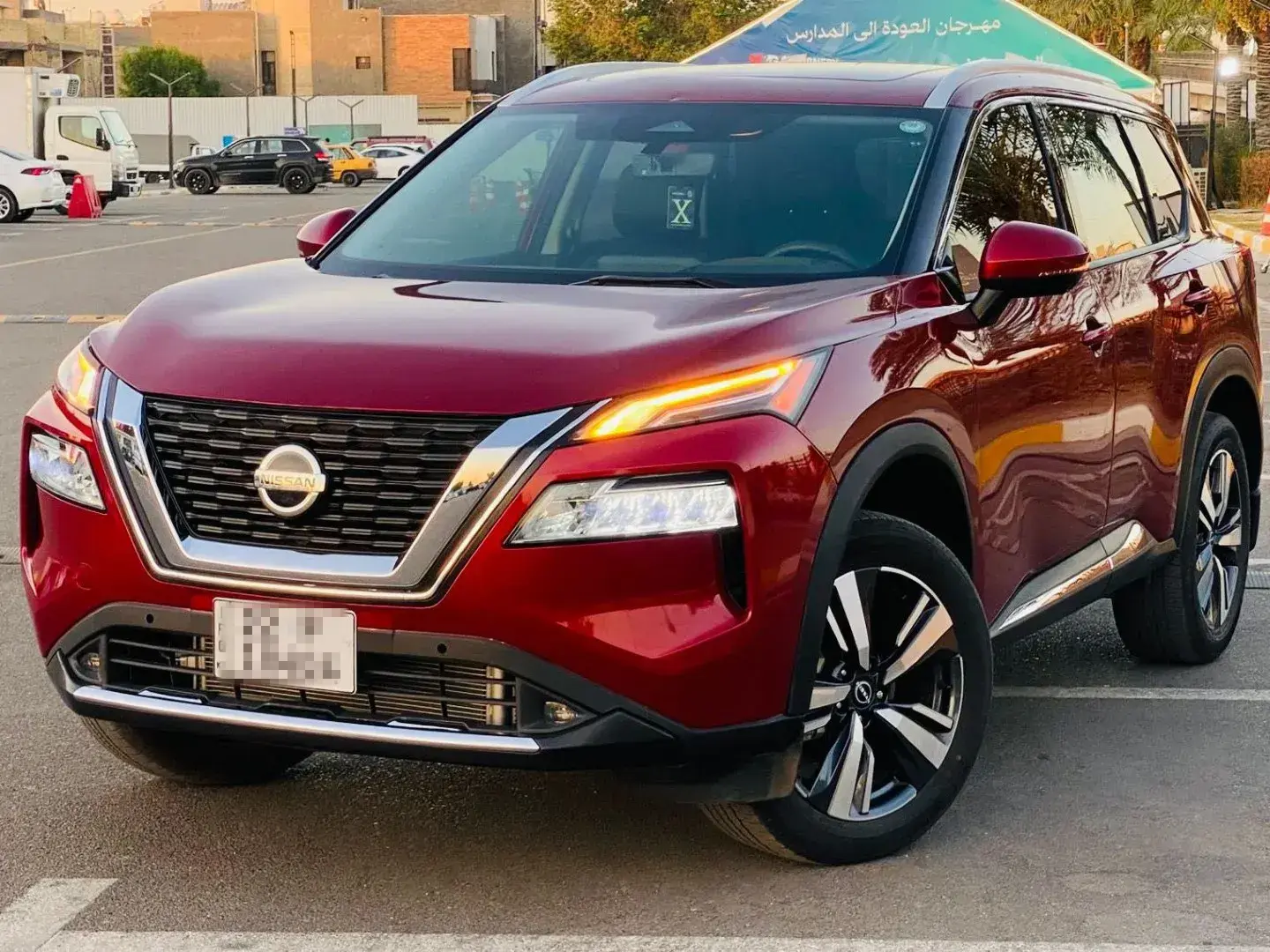 Nissan Rogue SUV shown in Scarlet Ember Color
