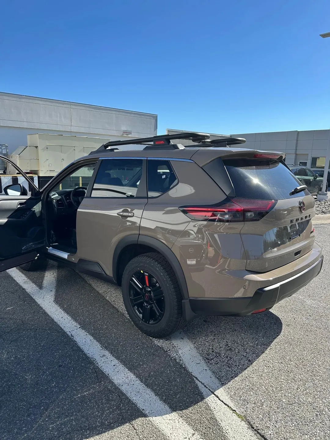 Nissan Rogue shown in Baja Storm Metallic Paint Color