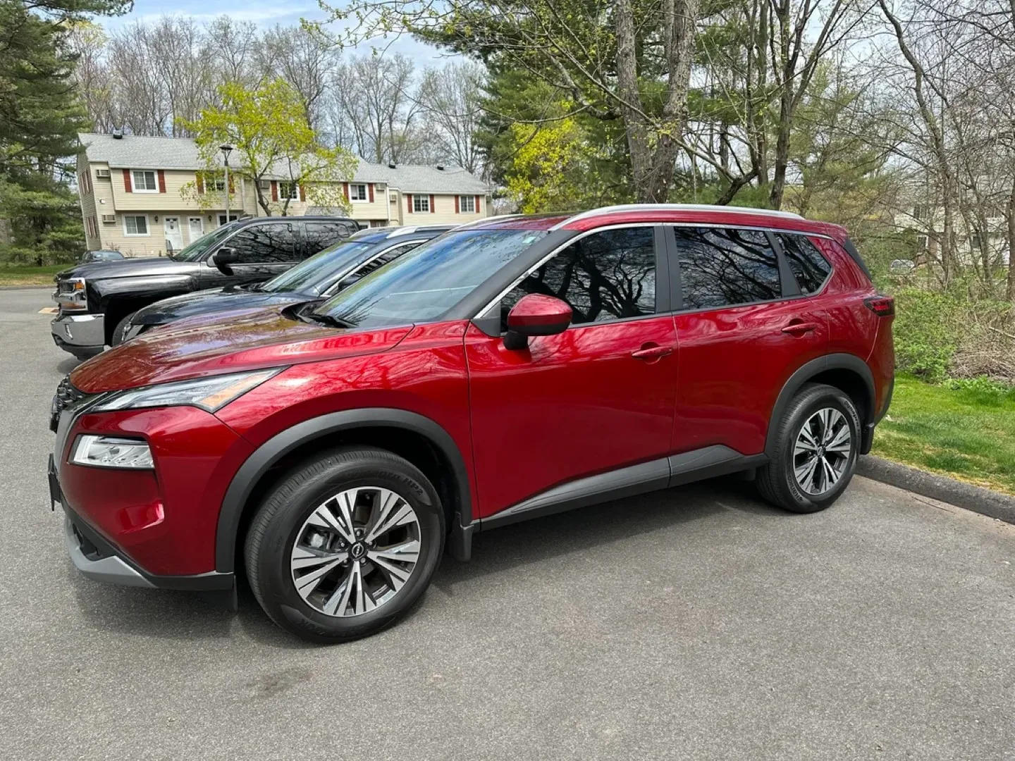 Red Nissan Rogue SUV