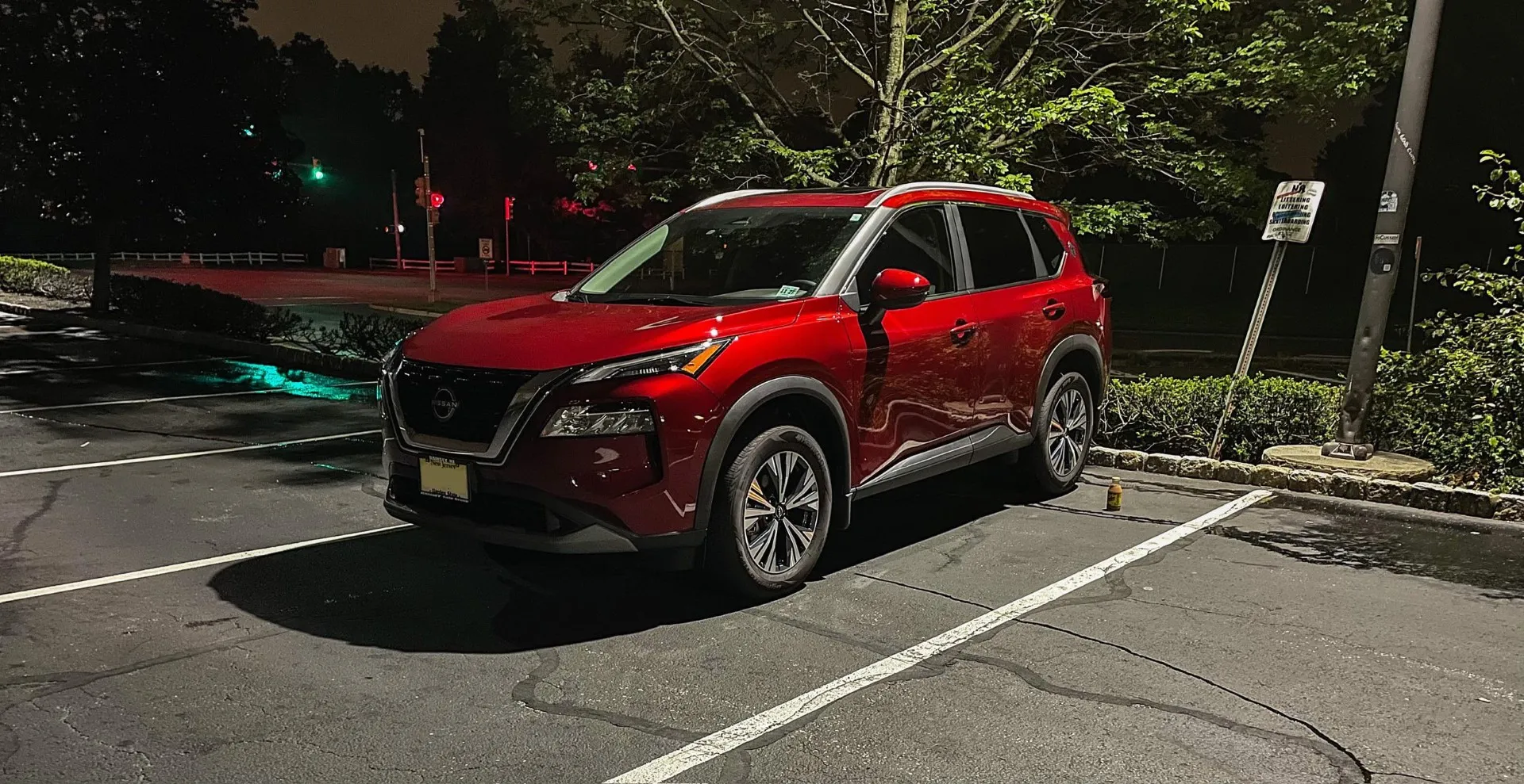 Red Nissan Rogue at night