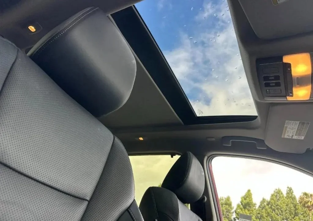 Interior view of Nissan Rogue panoramic moonroof looking at the sky